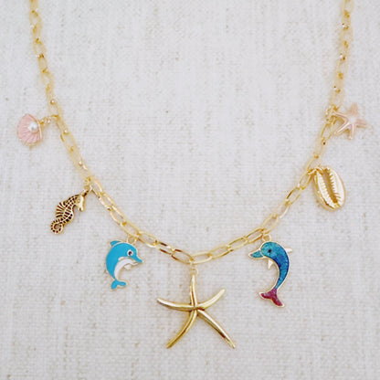 Women's Ocean Play Charm Necklace | Dolphin, Starfish, Seahorse & Shell Design